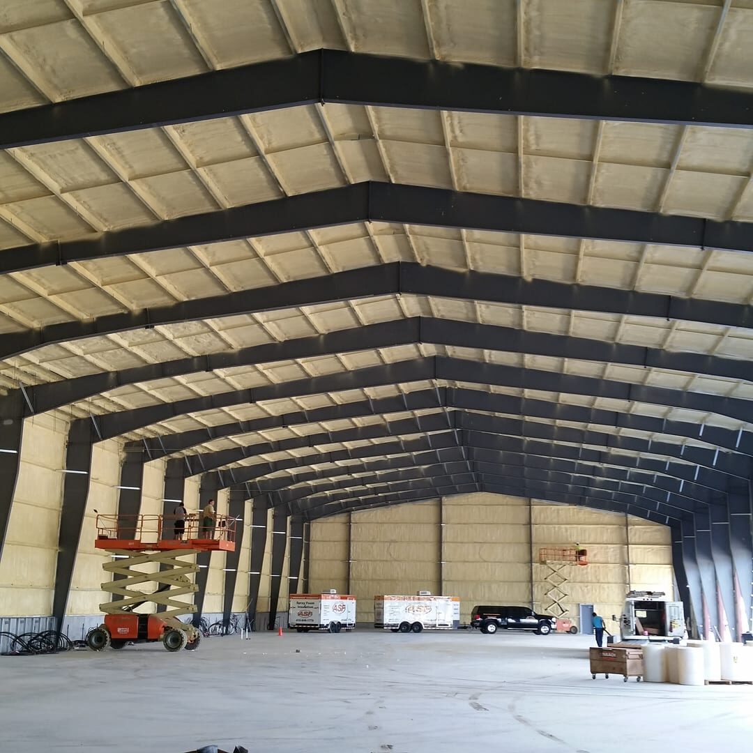 A large warehouse with many workers in it